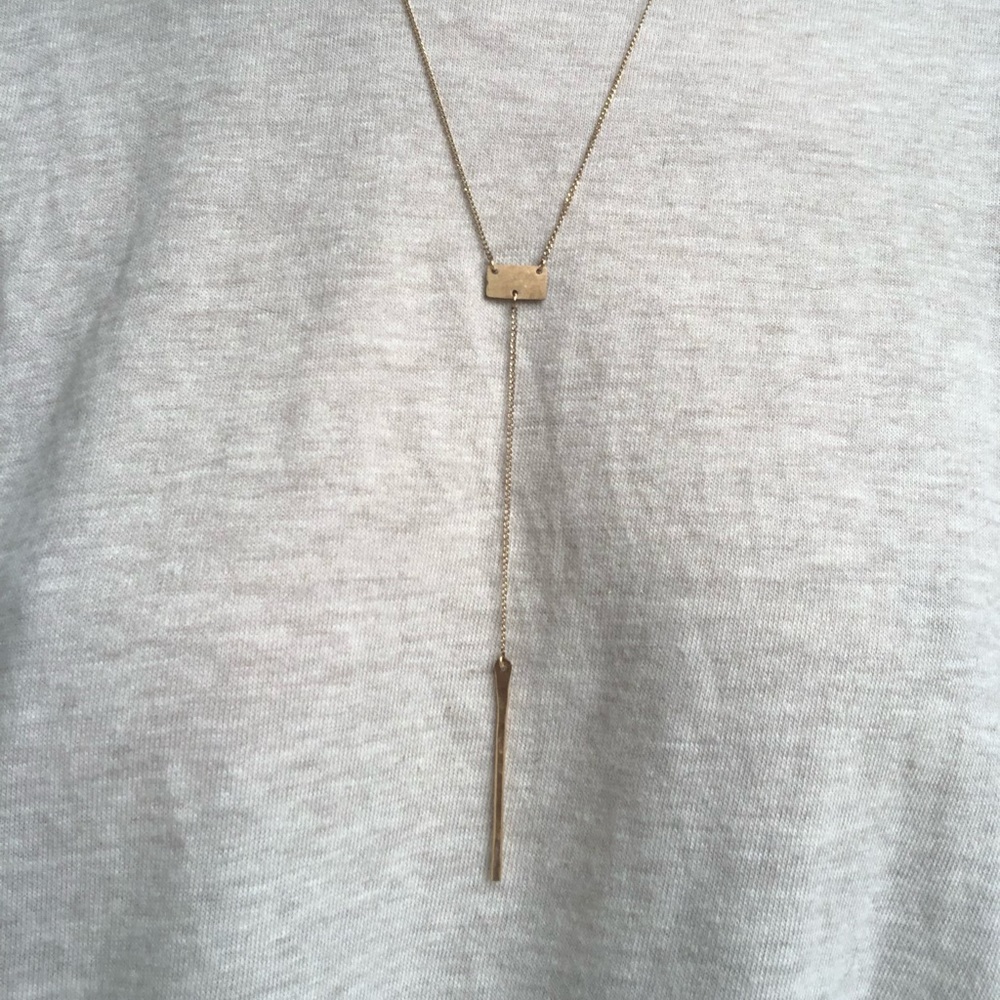 dainty gold necklace with charm